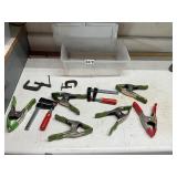 Plastic tote of assorted clamps