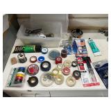 Plastic tote of silicone, JB weld, assorted tape
