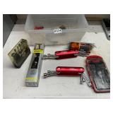 Plastic tote of nut drivers and level
