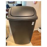 Black plastic trashcan