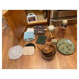 Dish clothe, first aid kit, wooden bowls, platter.