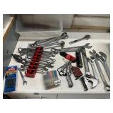 Plastic tote with wrenches, crescents