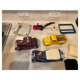 Assorted model cars and pieces