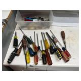 Plastic tote of assorted screwdrivers