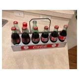 Vintage aluminum, Coca-Cola tray and nine bottles