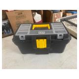 Plastic toolbox half filled with Coke bottle caps