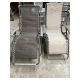 2 folding lawn chairs. One good all way