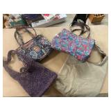 Four colorful tote bags