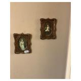 Gold colored framed man and woman