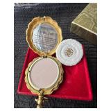 Gold colored mini powder compact