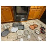 Copper skillet, baking trays- red pots all