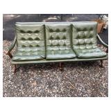 Vintage green couch ï¿½ needs some attention