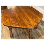 Wooden table with hide a way leaf