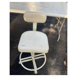 White swivel bar stool