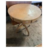 Round wooden table with drawer