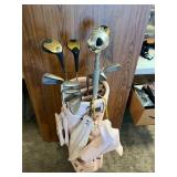Golf clubs and pink bag