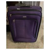 Purple rolling suitcase