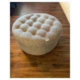 Gray padded storage ottoman