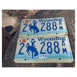 pair vintage wyoming license plates w/ cowboy