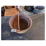 Footed cast iron bean pot with handle and basket