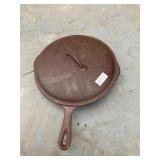 Cast iron skillet with heat ring with lid
