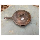 Cast iron skillet with heat ring with lid