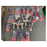 Coil spring expanders, tire gauge battery post