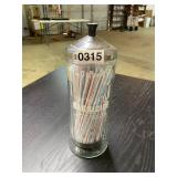 Straws in a barbicide container