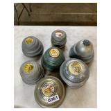 7 vintage wind up powder boxes some work