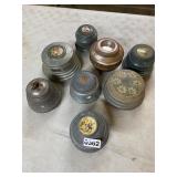 8 vintage wind up powder boxes some work