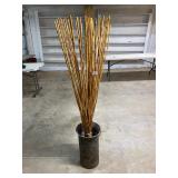 Large metal can with bamboo stick decor