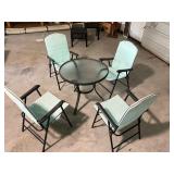 Round patio table and four chairs
