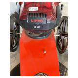 62 volt DR trimmer w/ charger. Runs