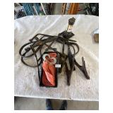 To strap, jumper, cables, jack and tire tool