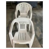 4 white plastic chairs