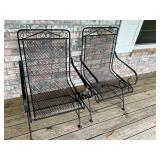 2- black wrought iron chairs