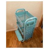 Teal metal rolling storage