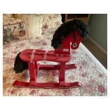 Red wooden rocking horse