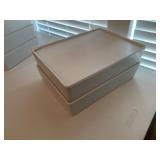 2 white lidded storage boxes