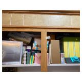 Top shelf stuffed with all things ï¿½cardsï¿½