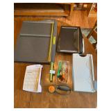 Swing arm paper cutters