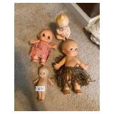 4 kewpie type dolls