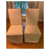 2 sitting chairs with covers