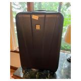 P- black hard plastic rolling suitcase