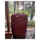 Purple rolling suitcase