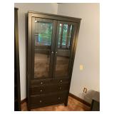Black cabinet with doors and storage