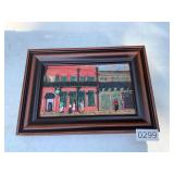 Framed wood carved street scene