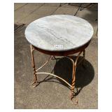 Metal base and marble top table