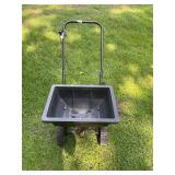 Black garden / yard wheeled seeder
