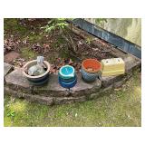 Assorted flower pots and bird